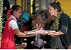  ?? PHOTO: MICHAEL CRAIG/STUFF ?? Prime Minister Jacinda Ardern receives a gift at the Fasi Government School in Tonga.