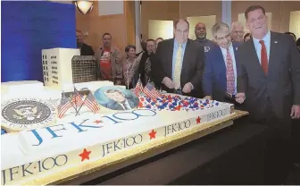  ?? Staff photo by angela rowlings ?? SWEET MEMORIES: Boston Mayor Martin J. Walsh, right, cuts a cake by Montilio’s Bakery celebratin­g John F. Kennedy’s 100th birthday at the John F. Kennedy Library. Left of Walsh is Kennedy Library Foundation executive director Steve Rothstein and the...