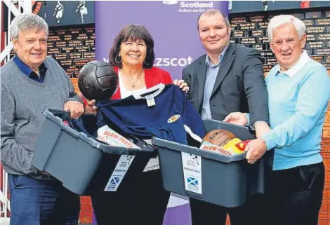  ??  ?? Boxing clever: Football Memories Scotland project training co-ordinator Michael White, Amanda Kopel, Football Memories Scotland project director Richard McBrearty and former player Gordon Wallace at Tannadice.