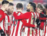  ??  ?? TOP MAN Saman Ghoddos celebrates with team-mates