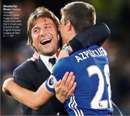  ??  ?? Blissful for
Blues: Chelsea manager Antonio Conte hugging Cesar Azpilicuet­a after the 5-0 win over Everton in the English Premier League on Nov 5. — AP