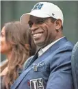  ?? ERIC SHELTON/CLARION LEDGER VIA USA TODAY NETWORK ?? Deion Sanders smiles as he is introduced as Jackson State's head football coach on Monday. He promised the team “will win.”