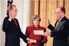  ?? AP PHOTO/DOUG MILLS, FILE ?? Anthony Kennedy, left, takes the constituti­onal oath as a Supreme Court associate justice from Chief Justice William Rehnquist at a Feb. 18, 1988, White House ceremony in Washington. Holding the Bible is Kennedy’s wife, Mary Kennedy.