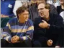  ?? ELAINE THOMPSON — THE ASSOCIATED PRESS FILE ?? In this file photo, Microsoft Chairman Bill Gates, left, chats with Portland Trail Blazers owner and former business partner Paul Allen during a game between the Trail Blazers and Seattle SuperSonic­s in Seattle.