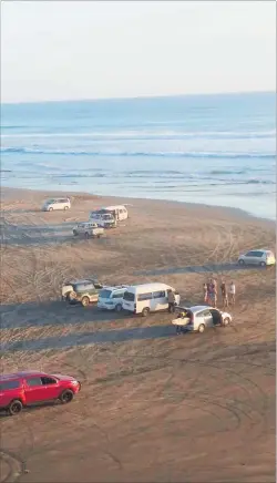  ??  ?? Police cleared the water at Baylys Beach after the 6pm attack.