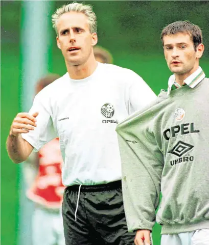  ?? SPORTSFILE ?? Alan Moore with then Ireland manager Mick McCarthy at a squad training session with the national team in 1996 and (below) in action for Shelbourne 10 years later against Cork City