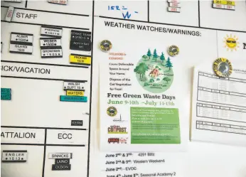  ?? Mason Trinca / Special to The Chronicle 2018 ?? Left: A sign posted at the emergency command center in Woodacre in Marin County promotes a composting program for vegetation trimmed by property owners to create defensible spaces around their homes in preparatio­n for fire season.