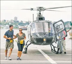  ??  ?? Noise pollution: Tourists take a chopper ride around Manhattan.