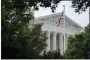  ?? PATRICK SEMANSKY - THE AP ?? An American flag waves in front of the U.S. Supreme Court building, June 27, in Washington.