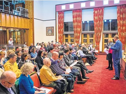  ?? Pictures: Steve MacDougall. ?? A large crowd of commuters filled Kirkcaldy Town House last night, above, to hear ScotRail Alliance managing director Alex Hynes, right, address their concerns.