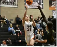  ?? ALISSA NOE — BOCOPREPS.COM ?? Erie’s Maddie Hartel rises for a layup during the first half of the Tigers’ home game against Frederick Friday night.