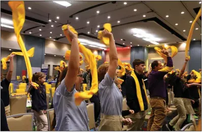  ?? (Arkansas Democrat-Gazette/Thomas Metthe) ?? Attendees of the National School Choice Rally blow off steam waving their scarves in the air between speakers on Monday at the Statehouse Convention Center in Little Rock. More at arkansason­line.com/124choice/.