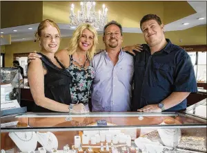  ?? ALLEN EYESTONE / THE PALM BEACH POST ?? Designer’s Touch Jewelry co-owners (from left) Nancy Guritsky, Ellen Yorke, Harry Yorke and Adam Yorke at their store in Wellington Reserve. The business is moving to the corner of Stribling Way and S.R. 7.