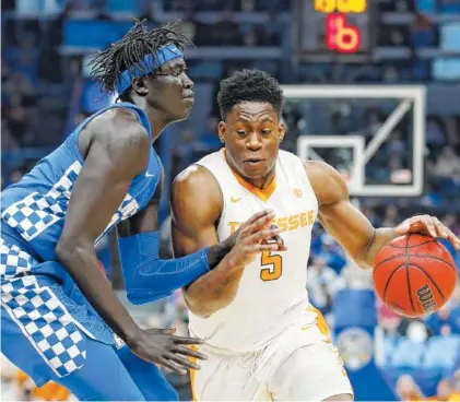  ?? KYLE ZEDAKER/TENNESSEE ATHLETICS ?? Kentucky sophomore forward Wenyen Gabriel, left, and Tennessee junior forward Admiral Schofield will look to lead their respective teams to deep runs in the NCAA tournament, which begins tonight with a pair of “First Four” matchups.