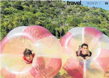  ?? Photo / Rob Cox ?? Bumper balls are great family-fun on Waiheke Island.