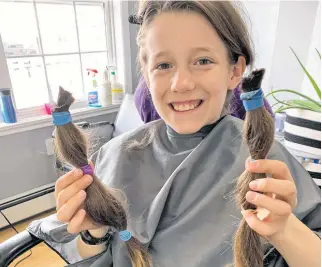  ??  ?? Heather Laura Clarke’s son donated two 12” ponytails to Angel Hair for Kids after a recent haircut. While he loves his new style, he says he may grow it long again to make another hair donation.