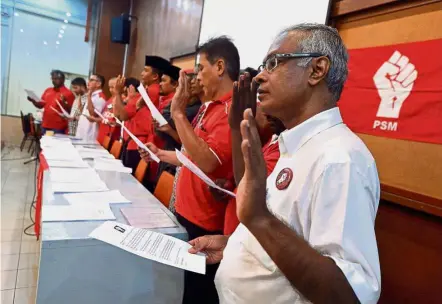  ??  ?? Anti-racism oath: PSM candidates making their pledges in Kuala Lumpur.