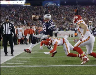  ?? STEVEN SENNE — THE ASSOCIATED PRESS FILE ?? In this file photo, Kansas City Chiefs free safety Husain Abdullah (39) pushes New England Patriots quarterbac­k Tom Brady (12) out of bounds short of the goal line during an NFL divisional playoff football game in Foxborough, Mass. The Patriots will...