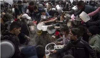  ?? ?? Palestinia­ns line up for a meal in Rafah, Gaza Strip, Thursday, Dec. 21, 2023. The United Nations appealed for $2.8 billion on Tuesday, April 17, 2024.