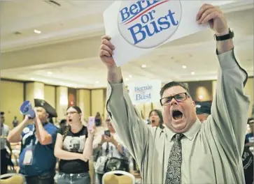  ?? Marcus Yam Los Angeles Times ?? BERNIE SANDERS supporters disrupt a breakfast meeting of California delegates in Philadelph­ia. “The Bernie delegation has never been a group to take marching orders,” said one Sanders delegate from the state.