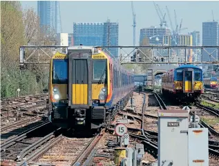  ?? CHRIS MILNER ?? Class 458515 approaches Clapham Junction on April 19, 2018, with a working to Windsor & Eton Riverside, but now the units are destined for the Portsmouth line to replace the 442s.