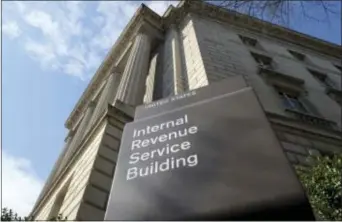  ?? SUSAN WALSH — THE ASSOCIATED PRESS FILE ?? This file photo shows the exterior of the Internal Revenue Service (IRS) building in Washington. Congressio­nal Republican­s are planning a massive overhaul of the nation’s tax system in 2017, a heavy political lift that could ultimately affect families...