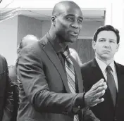  ?? JOE CAVARETTA South Florida Sun Sentinel ?? Florida Surgeon General Joseph Ladapo and Gov. Ron DeSantis at a news conference in West Palm Beach, Florida, on Jan. 6, 2022.