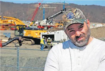  ?? [AP PHOTO] ?? In this April 30 photo, Chip Kohser, the Beaver County Republican chairman, stands overlookin­g the constructi­on of a chemical plant on the banks of the Ohio River near Beaver, Pa., that will help convert natural gas into plastic, creating hundreds of jobs in an area that has seen population dwindle since the collapse in the 1980s of the steel industry.