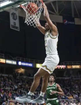  ?? ROB SIMMONS - THE ASSOCIATED PRESS ?? In this Jan. 27, 2019photo provided by Siena College, Siena point guard Jalen Pickett dunks during Siena’s NCAA college basketball game against Manhattan at Siena College in Loudonvill­e, N.Y. Pickett, who averages 15.5points and leads the MAAC with 6.4 assists per game, has helped lead Siena into contention for the Metro Atlantic Athletic Conference regular-season title.