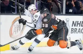  ?? Wally Skalij Los Angeles Times ?? DEFENSEMAN SHEA THEODORE (53) of the Ducks, battling Trevor Lewis of the Kings, saw his first playoff action last season.