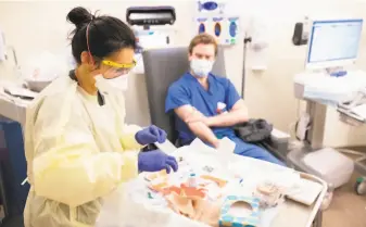  ?? Stanford Health Care ?? A Stanford Health Care worker is tested for the coronaviru­s. Most employees were tested.