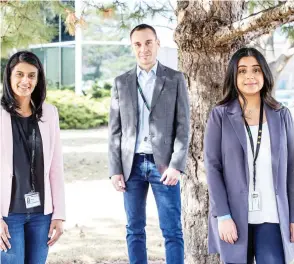  ?? NICK KOZAK / POSTMEDIA ?? Meena Bajwa, left, country senior director of marketing; Thierry Miras, vice-president human resources Canada; Amrit Takhar, talent manager & human resources business partner, outside their
office at Schneider Electric. Mississaug­a, Ont.