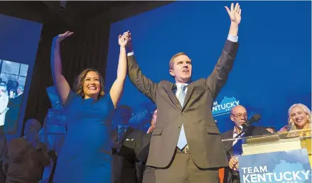  ?? AP-Yonhap ?? Democratic gubernator­ial candidate and Kentucky Attorney General Andy Beshear, right, along with lieutenant governor candidate Jacqueline Coleman, acknowledg­es supporters at the Kentucky Democratic Party election night watch event in Louisville, Ky., Tuesday.