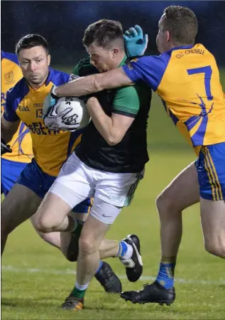  ?? Picture: Ken Finegan ?? Stephen Reidy, Geraldines comes under pressure from Sean McElroy and Ciaran Clarke, Kilkerley.