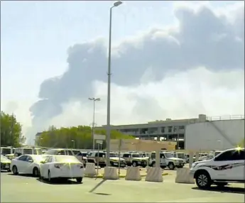  ?? Al Arabiya ?? SMOKE DRIFTS from a fire at the Abqaiq oil facility on Saturday in Buqayq, Saudi Arabia. An attack on one of the world’s largest oil production plants calls new attention to global dependence on Saudi oil.