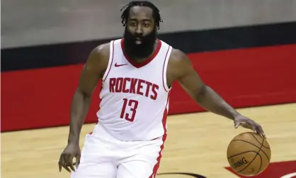  ?? Photograph: Carmen Mandato/ AP ?? James Harden of the Houston Rockets controls the ball during the first half of a preseason game last week.