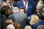  ?? CAROLYN KASTER - THE ASSOCIATED PRESS ?? House Speaker Nancy Pelosi of Calif., hugs Senate Majority Leader Chuck Schumer of N.Y., after she spoke on the House floor at the Capitol in Washington Thursday.