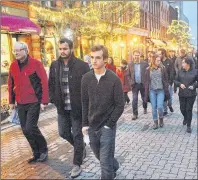  ?? GUARDIAN PHOTO ?? A group of about P.E.I. men, including, from left, Premier Wade MacLauchla­n and Dana Kenny, centre, of the Prime Minister’s Youth Council, marched down Richmond Street recently in solidarity with Island women following the second annual Stop the...