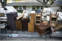  ?? ASSOCIATED PRESS ?? Flood-damaged furniture sits in front of a home in the aftermath of Hurricane Harvey in Houston. Harvey’s record-setting rains now have the potential to set records for the amount of debris one storm can produce.