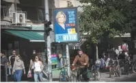  ?? (Miriam Alster/Flash90) ?? ELECTION POSTERS promote the mayoral candidacie­s of incumbent Ron Huldai and challenger Orna Barbivai on the streets of Tel Aviv, ahead of next week’s election.