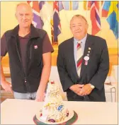  ??  ?? Petur Hagnason and Bill Gundersen with the Kransakaka — Crown Cake — they made for the occasion.