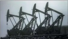  ?? THE ASSOCIATED PRESS ?? Oil pump jacks work in unison in Williston, N.D. Conserving oil is no longer an economic imperative for the U.S., the Trump administra­tion declares in a major new policy statement.