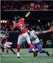  ?? DAVID GOLDMAN / The Associated Press ?? Atlanta quarterbac­k Matt Ryan (2) throws downfield while being pressured by the Minnesota defense.