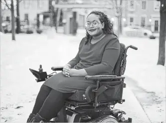  ?? PETER POWER THE CANADIAN PRESS ?? Sarah Jama, 23, a disability justice advocate who has cerebral palsy, poses for a portrait at her home in Hamilton on Tuesday.