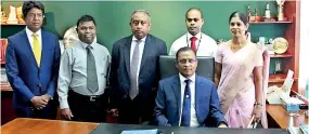  ??  ?? Senarath Bandara at his new desk after assuming his new position as GM/CEO of Bank of Ceylon