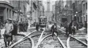  ?? TTC ?? Workers repair the streetcar line on Bay St. at Wellington St. on May 8, 1925.