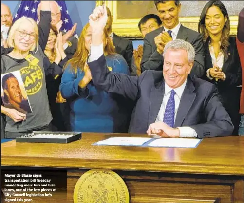  ??  ?? Mayor de Blasio signs transporta­tion bill Tuesday mandating more bus and bike lanes, one of the few pieces of City Council legislatio­n he’s signed this year.