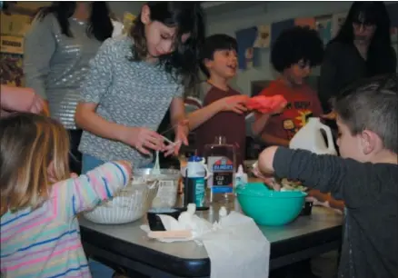  ??  ?? Children prepare their own homemade slime during a Family Super Saturday Slime Time program at the Oneida Public Library on Saturday, Jan. 12, 2019. See more photos on Page D4.