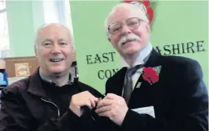  ??  ?? Accrington Pals Historian Les Bond (left) visited East Lancashire Concert Band’s 175th anniversar­y celebratio­n exhibition, where he was presented with one of the Band’s 175 Years commemorat­ive badges by the band’s honorary curator for the day Ian...