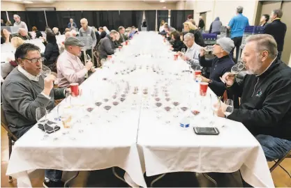  ?? PHOTOS BY MICHAEL SHORT ?? Sixtysix wine profession­als evaluated more than 6,700 wines vying for bronze, silver, gold, double gold and Best of Class awards and the prestigiou­s American AgCredit Sweepstake Award.